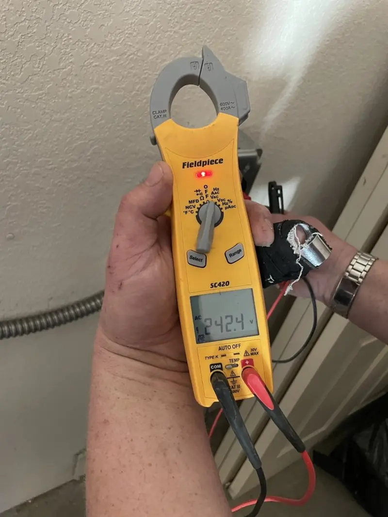 Voltage testing with clamp meter during Generator Installation in West Pleasant View